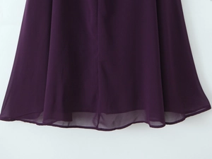 Detail view of the deep purple chiffon hem showing delicate stitching and sheer fabric