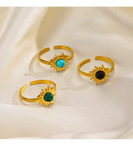 Macro view of bohemian stainless steel rings with turquoise, agate, and striped stone