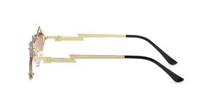 Detail view of irregular heart-shaped sunglasses with unique golden lightning temples