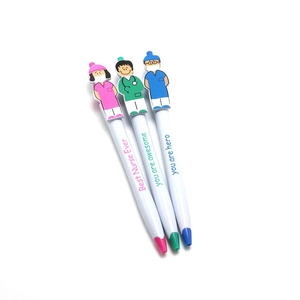 Three creative nurse cartoon ballpoint pens in pink, green, and blue on white background