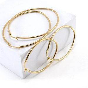 Two pairs of minimalist 18K gold plated titanium steel hoop earrings with high polish finish