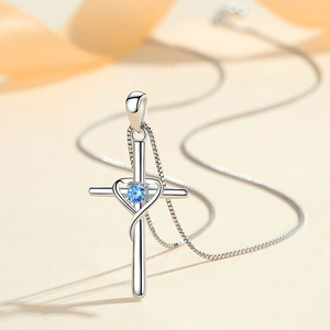 Elegant S925 silver cross necklace with a blue heart-shaped gemstone pendant for women
