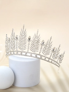 Detailed view of silver bridal crown featuring large pear-shaped crystals and rhinestones