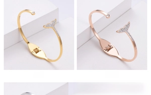 Detail of whale tail open bracelets in gold and rose gold with micro-pave crystals