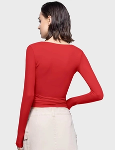 Detailed back view of a slim fit red long sleeve crop top with ruched hem detail