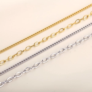 Detailed macro view of gold and silver plated stainless steel cuban and link chains