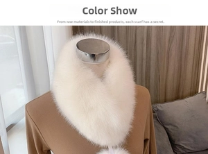 Close-up of fluffy white faux fox fur collar with ribbon balls and soft texture