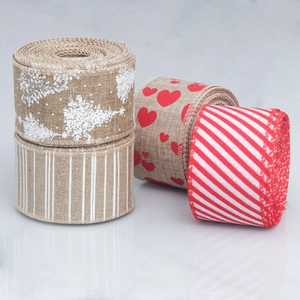Close-up of wired burlap ribbons featuring snowflake, heart, and stripe festive patterns