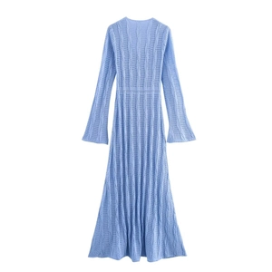 Close-up of light blue long sleeve knit dress with detailed hollow-out vertical texture