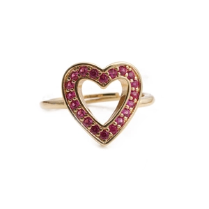 Detailed close-up of hollow heart ring with red zircons and adjustable gold-plated band