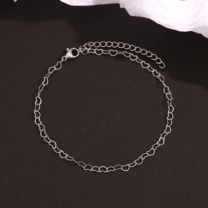 Detailed macro view of silver heart link chain with lobster clasp and extension