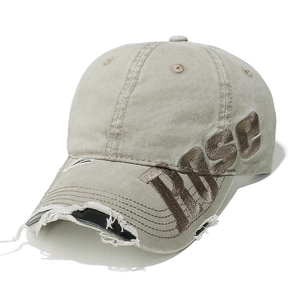 Detailed view of distressed washed cotton baseball cap with vintage ROSE letter embroidery