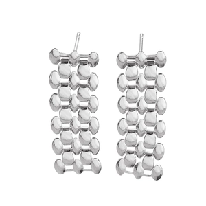 Detailed close-up of silver stud earrings with rectangular chain link mesh design