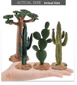Miniature desert plant set featuring baobab and cactus models held in hand for scale