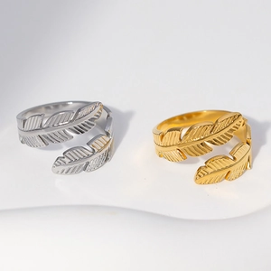 Adjustable stainless steel feather rings in gold and silver finish shown on white background
