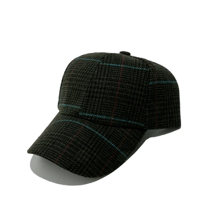 Detailed view of dark houndstooth pattern fabric on a classic structured baseball cap