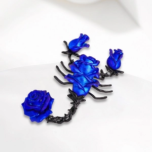 Gothic scorpion brooch featuring deep blue metallic roses and matte black alloy details