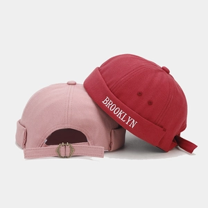 Detail of adjustable metal buckle and Brooklyn embroidery on vintage docker hats