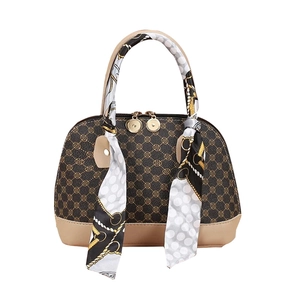 Mini shell handbag in brown and beige patterns with a decorative printed silk scarf