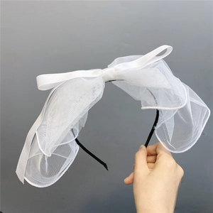 White polka dot mesh bow headband with short veil for bridal and wedding styling