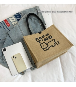 Linen tote bag with dog print shown next to iPad for realistic size comparison