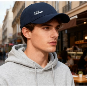 Detail of dark blue quick-dry baseball cap featuring laser-cut ventilation holes for breathability