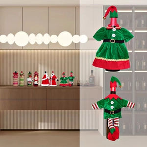 Detailed close-up of Christmas wine bottle covers with gnome elf designs in red and green
