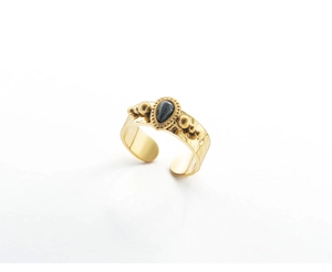 Detail of vintage 18K gold plated ring featuring a black water-drop gemstone and hammered texture