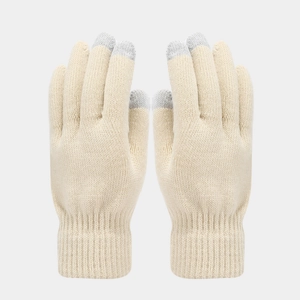 Detail of cream knit touchscreen gloves with grey conductive fingertips and ribbed cuffs