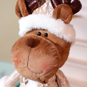 Detailed close-up of a Christmas reindeer plush with golden sequins and white faux fur collar