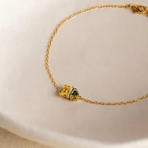 Minimalist 14K gold plated stainless steel bracelet with green and yellow zircon charms