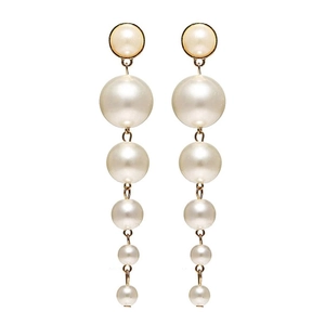 Detailed view of layered faux pearl drop earrings with elegant gold link connectors
