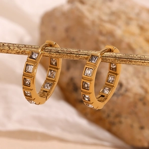 Close-up of 18K gold plated stainless steel hoops with inlaid square cubic zirconia