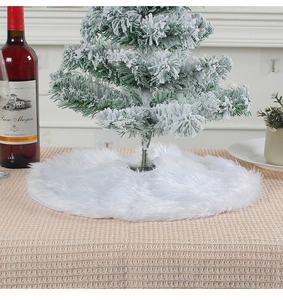 Close-up of white plush mini Christmas tree skirt on checkered tablecloth decor