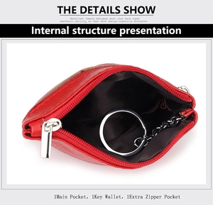Detail of red genuine leather key wallet showing main pocket and silver metal keyring