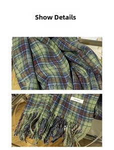 Detail of vintage green plaid scarf featuring long fringes and unique textile label