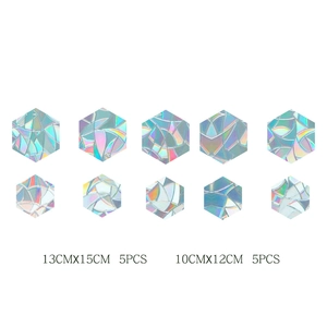 Detail view of 10 holographic hexagonal window film stickers in two various sizes