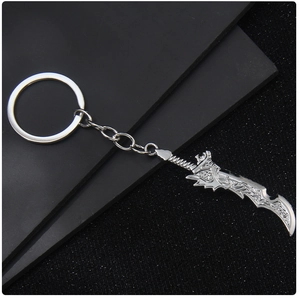 Detailed view of silver metal sword keychain with textured blade and polished finish