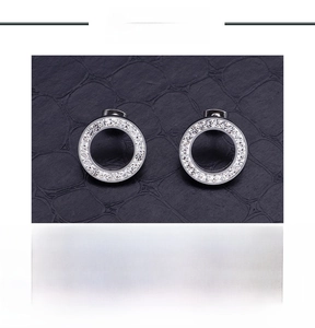 Detailed view of silver stainless steel stud earrings with crystal halo and product specs