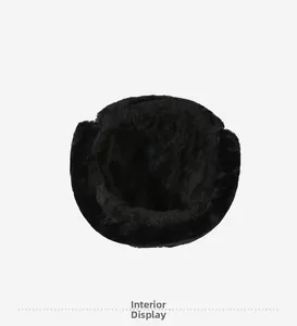 Close-up of thick black faux fur lining on winter hat for thermal insulation