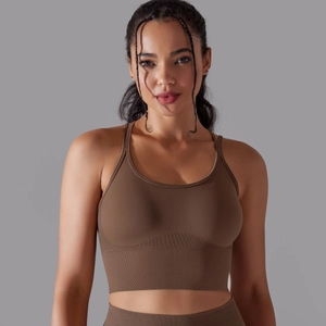 Detail of seamless ribbed sports bra with cross-back design and textured fabric
