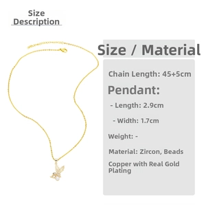 Detailed view of moon and heart pendant with zircon inlay and 45+5cm gold chain