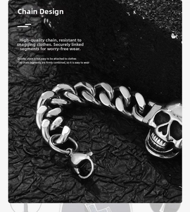 Close-up of polished punk style heavy curb chain bracelet with skull charm detail