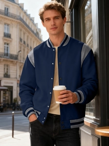 Detail of navy varsity jacket with grey raglan sleeves and striped ribbed collar edges