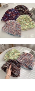 Close-up of thick multicolored handmade knit texture on chunky crochet winter bucket hats