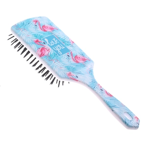 Detail of blue air cushion hairbrush with pink flamingo pattern and love you text