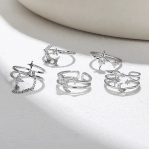 Detailed view of S925 silver star and moon rings set with sparkling zircon stones