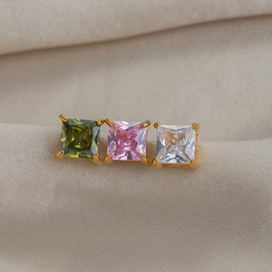 Macro shot of 18K gold-plated square cubic zirconia stud earrings in three elegant colors