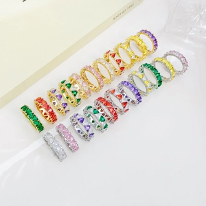 Golden and silver eternity rings with colorful triangle-cut zircon crystals