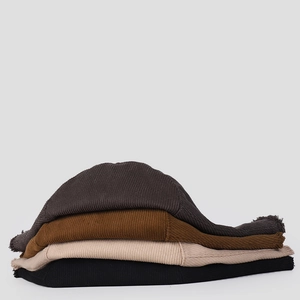 Corduroy bucket hats set with fringe edges in grey, brown, beige, and black colors